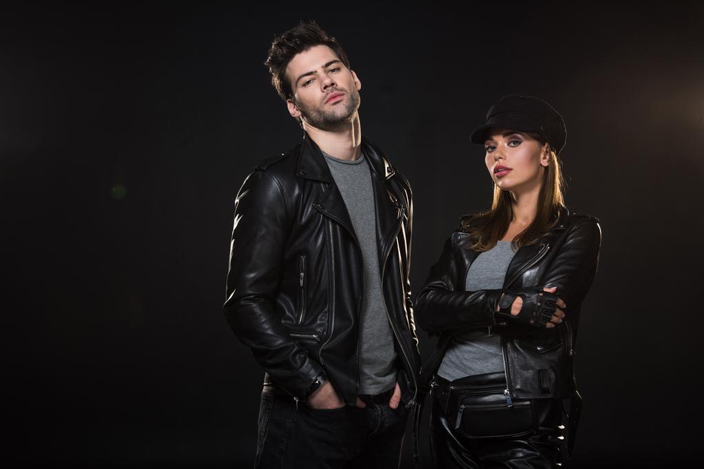 stock-photo-beautiful-couple-leather-jackets-looking-camera-posing-black-background