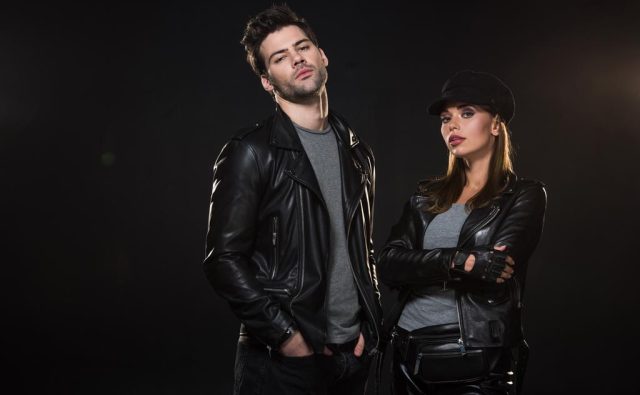 stock-photo-beautiful-couple-leather-jackets-looking-camera-posing-black-background